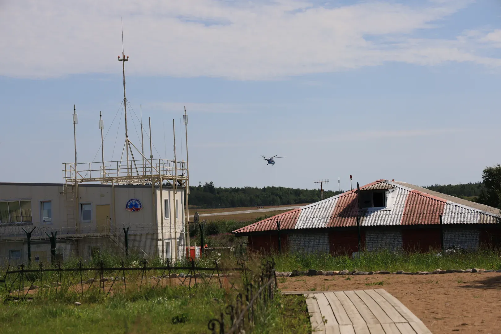 A helicopter leaving the helipad after delivering mail and Ozon parcels. That day we went to the airport because we were at the post office and were told that the postman was away receiving this delivery.