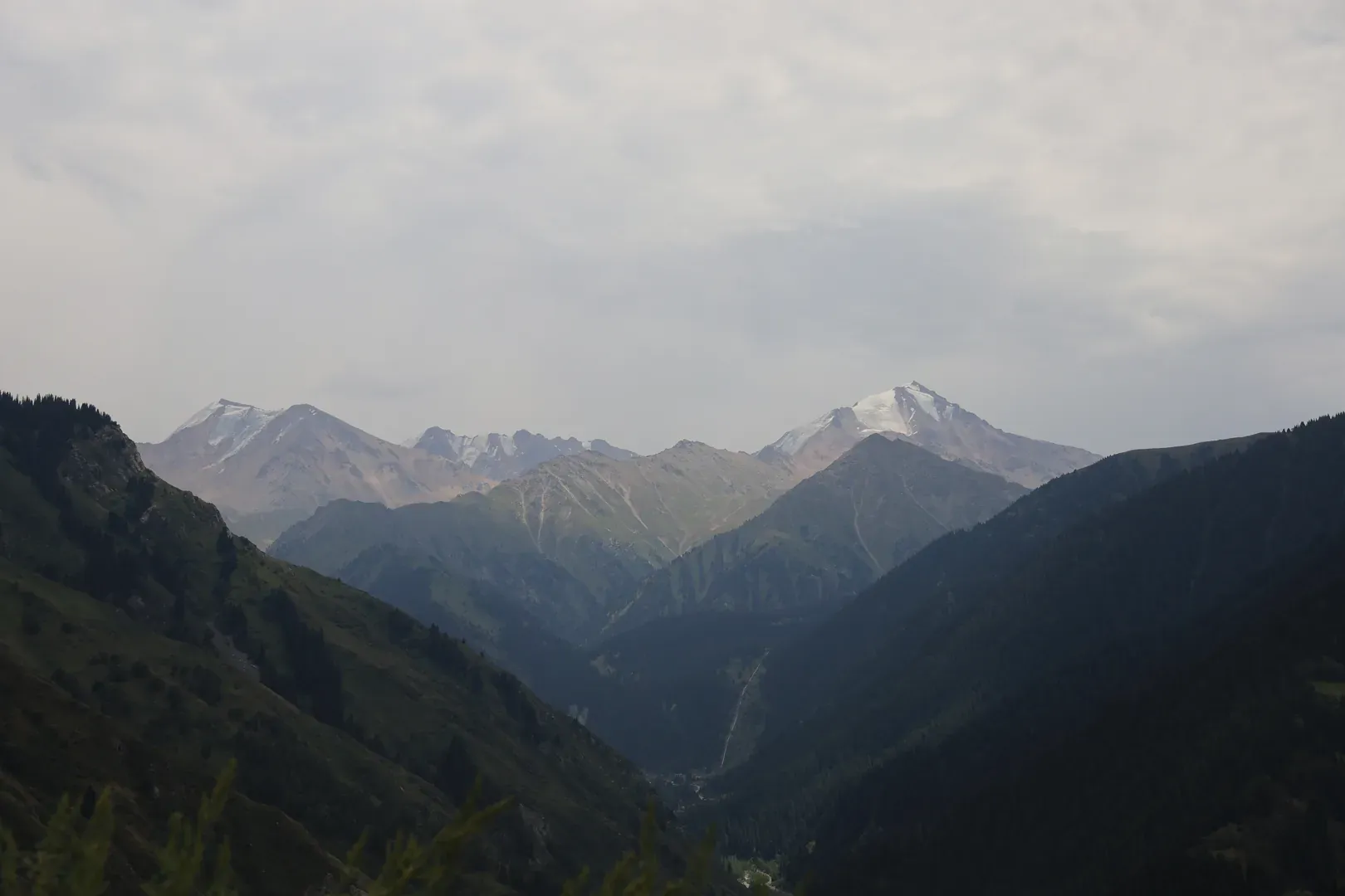 The southern range with glaciers on its tops. There is a trail that will take you into Kyrgyzstan, near its famous lake Issyk-Kul.