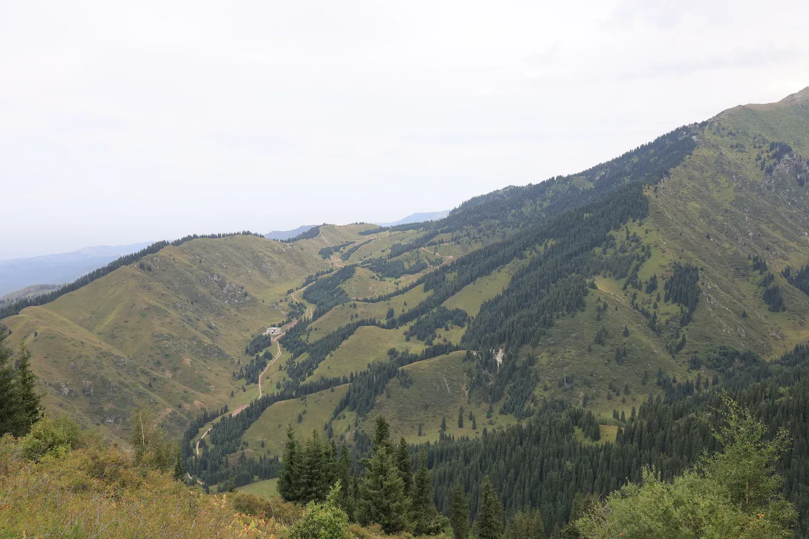 A more complete view of the path to Kok Zhailau. You can clearly see the road, the construction sites, and the plateau itself.