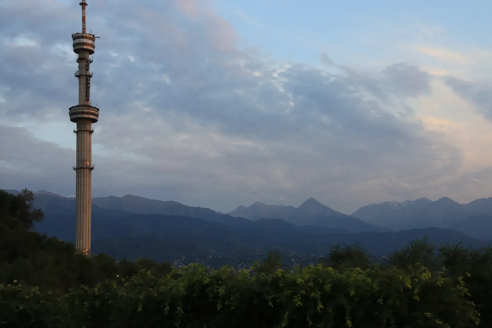 A view of the Almaty television tower in the evening.