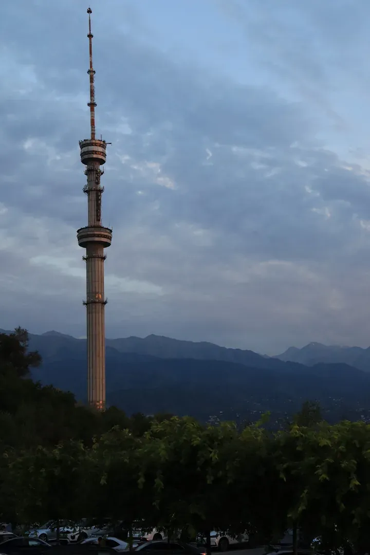 The Almaty tower is not only visible from most of the city — at night it also lights up, shimmering through several colours until sunrise.