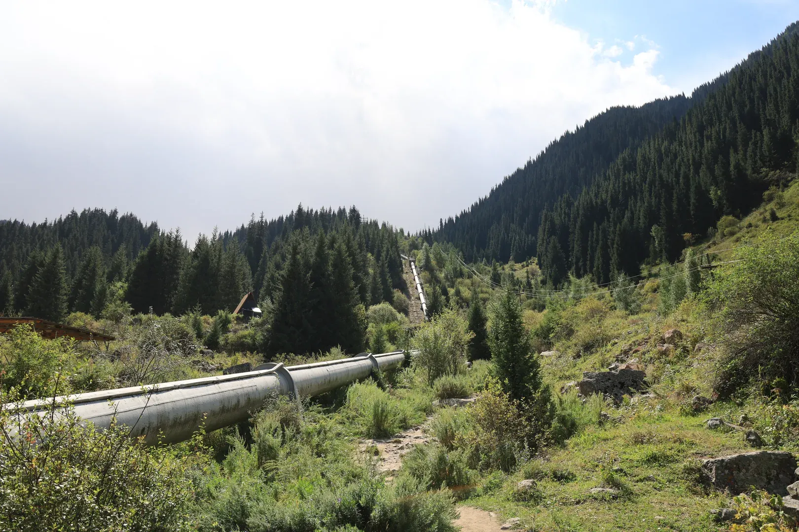 The water pipe, a landmark visible from far away, and the trail beside it.