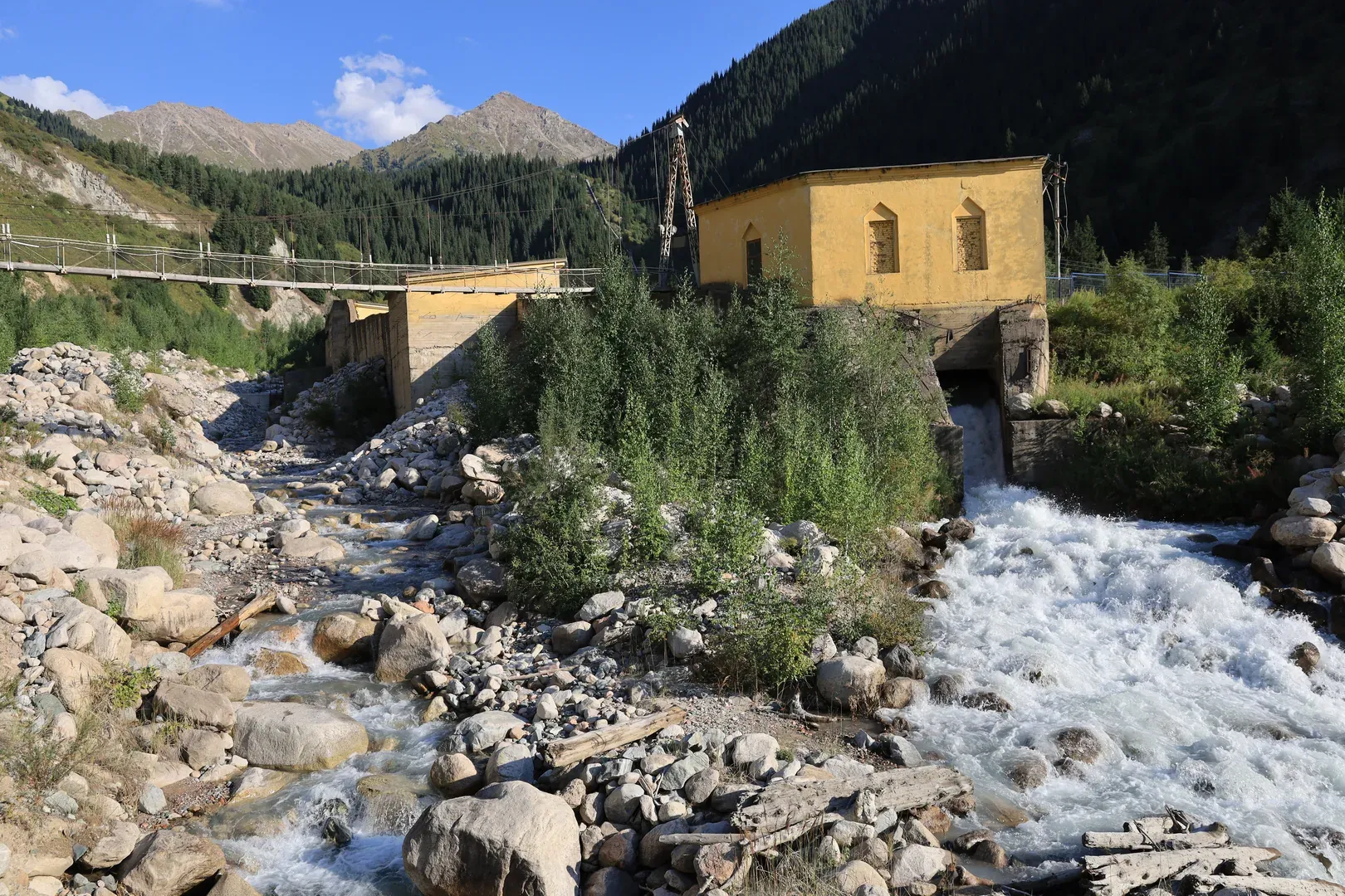 The same structures seen from a road bridge crossing the merged rivers.