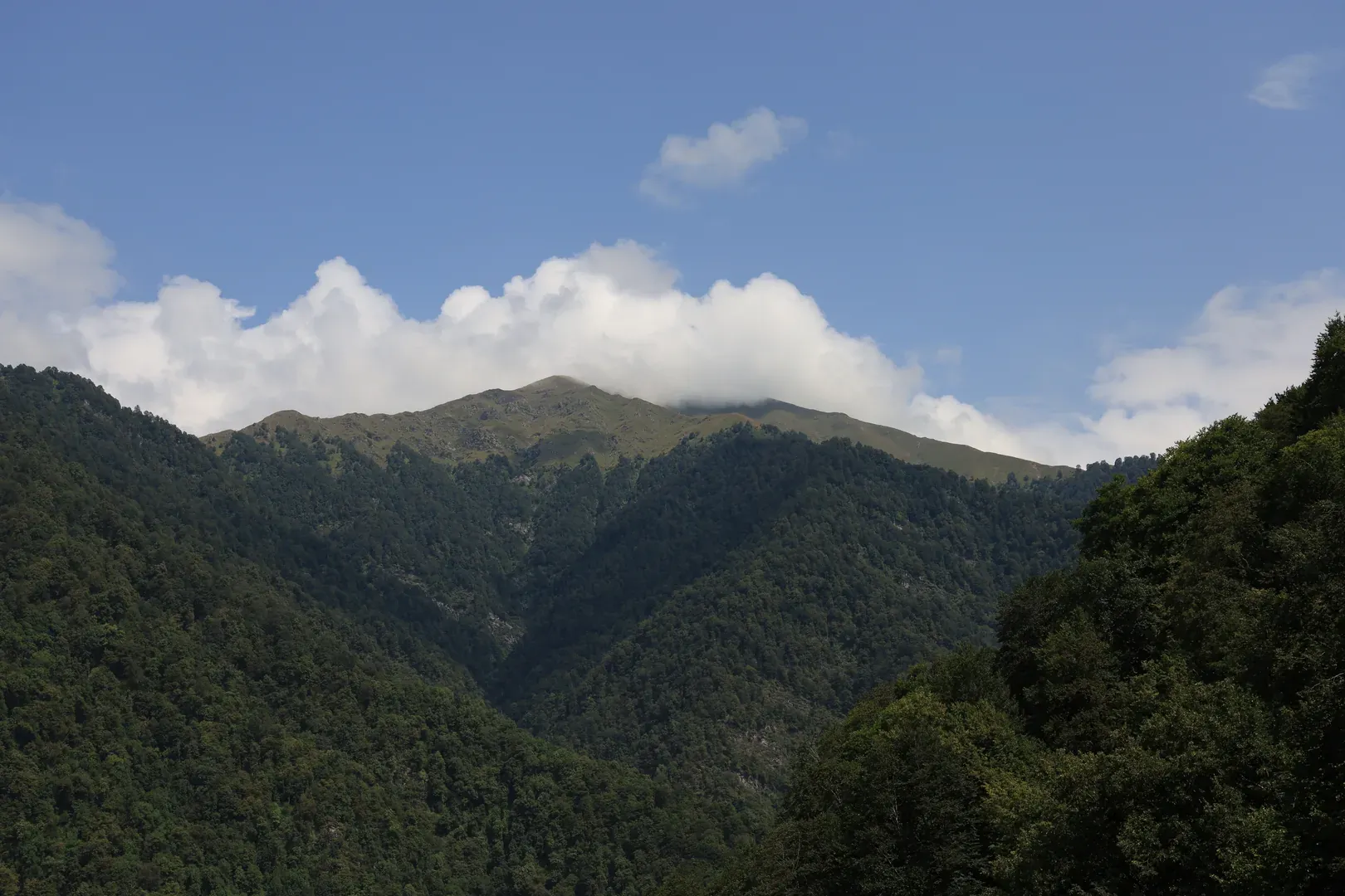 Sometimes you get a magnificent view of the local mountains. As you climb, the mountain view is mostly replaced by forest and the rocky walls of the gorge.